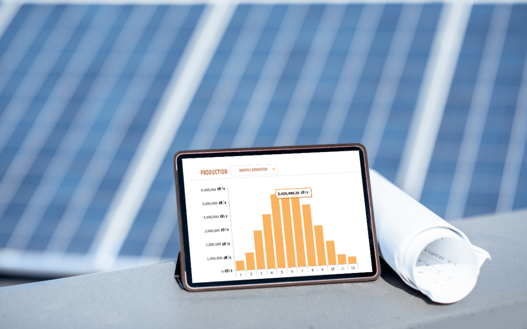 A solar array with an ipad in front displaying a graph.