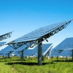 A solar farm on grass.