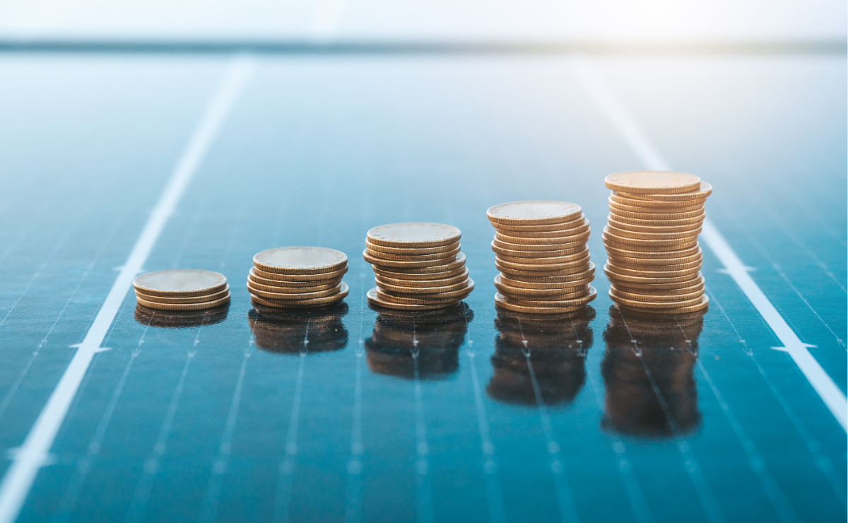 Stacks of coins on a solar panel.