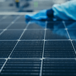 Wiping down a solar cell in a factory